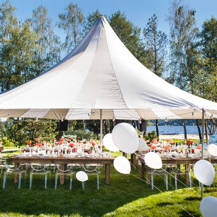 Party & Event RentalsWhite party tent set up on a clear day