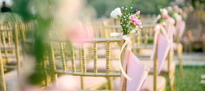 Wedding chairs with pink ribbons